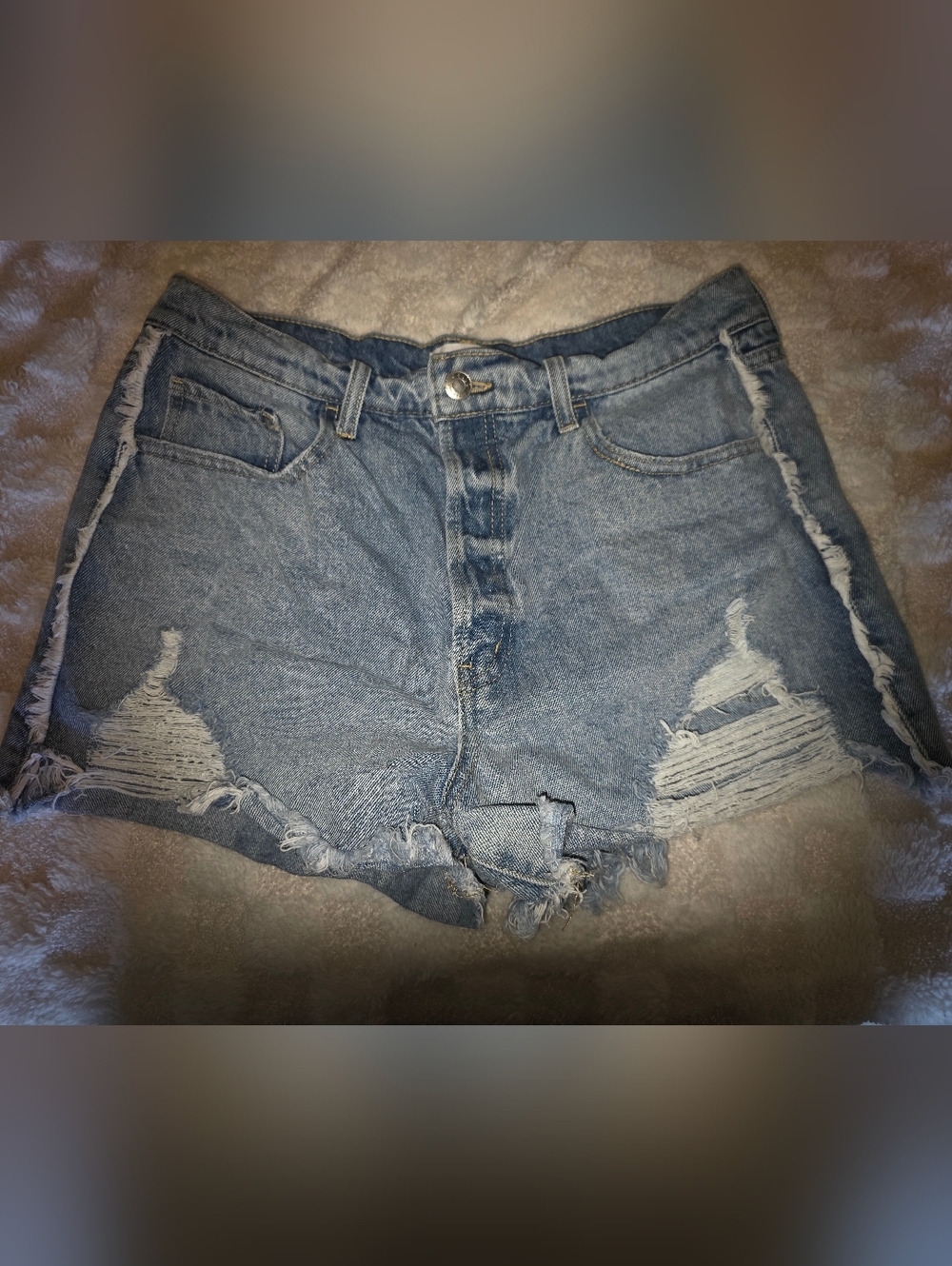 High-Rise Light Blue Distressed Denim Shorts